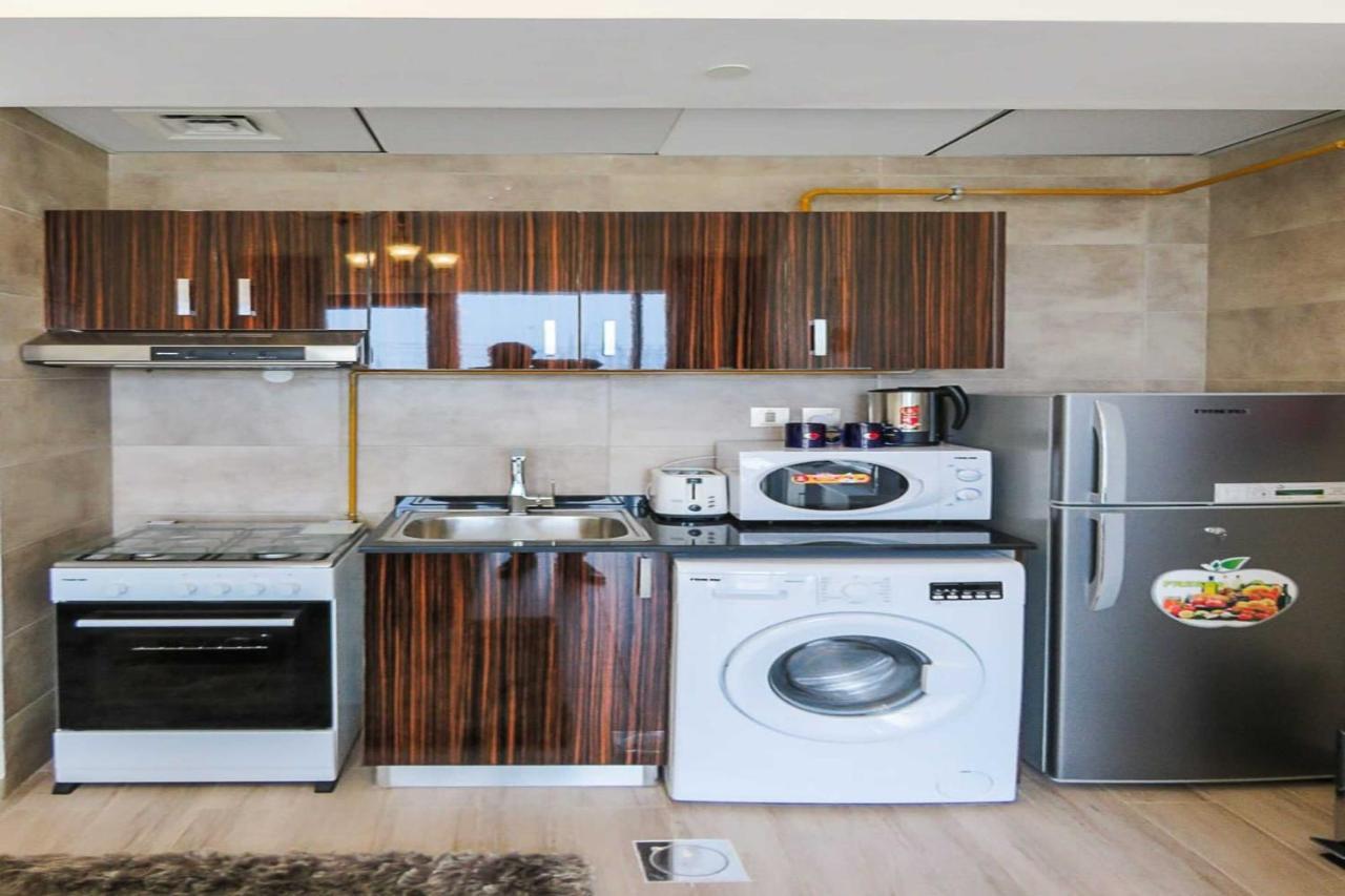 Oyo 860 Studio Apartment, Maya Tower 4, Jumeirah Village Triangle Dubái Exterior foto