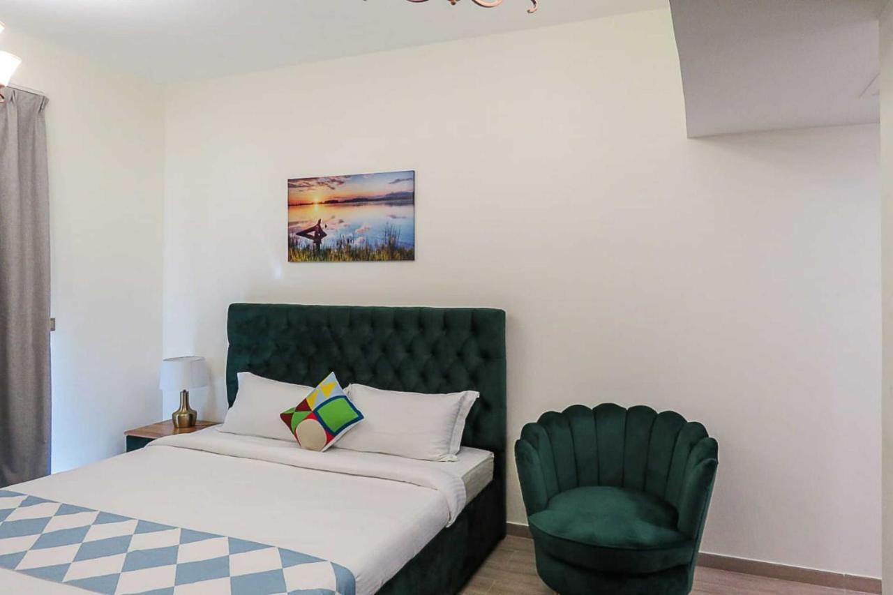 Oyo 860 Studio Apartment, Maya Tower 4, Jumeirah Village Triangle Dubái Exterior foto