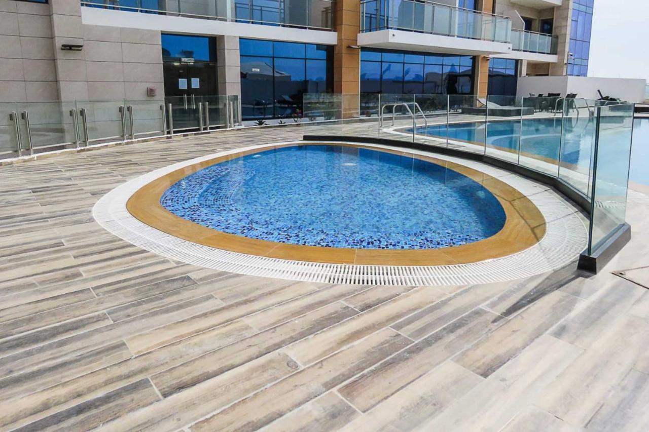 Oyo 860 Studio Apartment, Maya Tower 4, Jumeirah Village Triangle Dubái Exterior foto